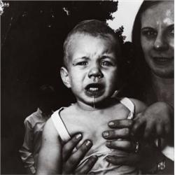 DIANE ARBUS (American, 1923-1971) MOTHER HOLDING HER CHILD signed “Diane Arbus” in pencil on vers...