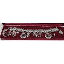 STERLING SILVER CHARM BRACELET WITH 12 LARGE
