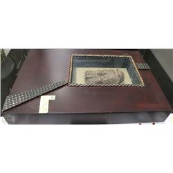 A MASK IN A WOODEN FRAME 20” X 14”