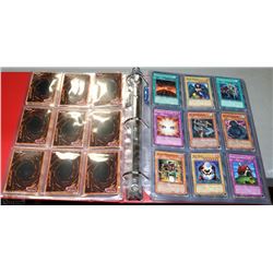 ALBUM OF 180 VINTAGE YU-GI-OH TRADING CARDS