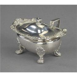 A good George III mustard, of Regency boat form beneath a hinged domed lid, urn finial, the broad...