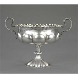 An Art Nouveau two-handled pedestal dessert stand, hammer textured overall, the lobed circular bo...