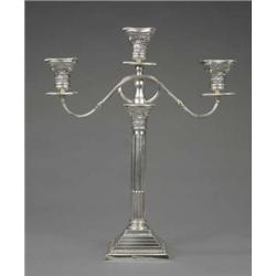 A George V Corinthian column three-light candelabrum, with square stepped and beaded base and det...