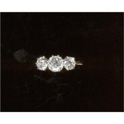 A three-stone diamond ring, c.1945, the graduated circular cut stones of earlier period   £900/1,...