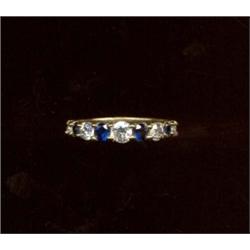 A nine-stone sapphire and diamond ring, c.1975, graduated claw set stones   £200/250...