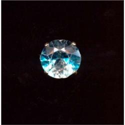 A large blue zircon ring, c.1950, the circular zircon with pair of peg set brilliant cut diamonds...