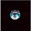 Image 1 : A large blue zircon ring, c.1950, the circular zircon with pair of peg set brilliant cut diamonds...