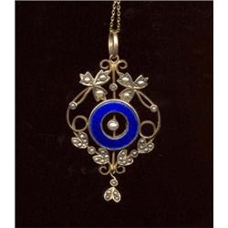 A half-pearl and blue enamelled brooch, c.1890, of scrolling foliate design, the central circular...
