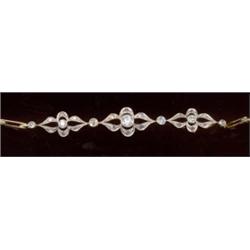 A diamond bracelet, c.1915, comprising graduated motifs of geometric design, each with a central...