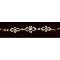 A diamond bracelet, c.1915, comprising graduated motifs of geometric design, each with a central...