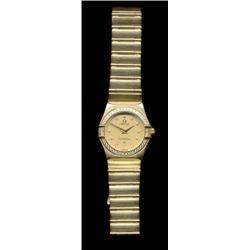 An 18ct gold and diamond lady's quartz wristwatch, Omega Constellation, the champagne dial set wi...