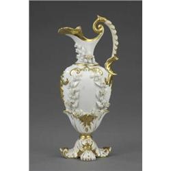 A Rockingham slender ewer, encrusted with wreaths and garlands of flowers in white and with gilt...