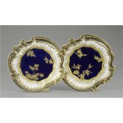 A pair of Copelands dessert plates, with royal blue centre gilt with rosebuds and leaves, the rad...