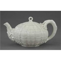 A Belleek teapot and cover, Tridacna pattern, with 'coral' handle and knop, 9in wide, black mark,...