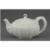 Image 1 : A Belleek teapot and cover, Tridacna pattern, with 'coral' handle and knop, 9in wide, black mark,...