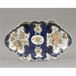 A Worcester blue scale oblong hexagonal spoon tray, the 'mirror' reserves painted and gilt with f...