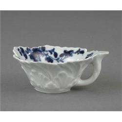 A Worcester spirally leaf moulded butter boat, painted with flowers in blue, 3.5in wide, workman'...