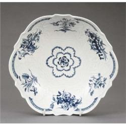 A Worcester junket bowl, moulded and painted in blue with central flower, the fluted shell moulde...