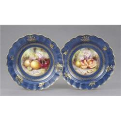 A Royal Worcester powder blue deep plate, the central circular reserve painted with a segmented o...