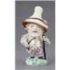A Derby figure of a Mansion House dwarf, wearing gilt star and turquoise jacket, pink breeches an...