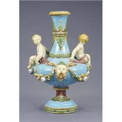 A Minton majolica vase, mounted with putti, fruit, garlands and masks, the narrow neck and stem m...