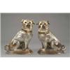 Image 1 : A pair of Victorian figures of seated pugs, with shaded grey glaze and glass eyes, 11.75in high...