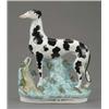 Image 1 : An unusual Staffordshire figure of a standing greyhound, with black splashed coat, the turquoise...