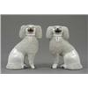 Image 1 : A small pair of Staffordshire figures of seated poodles, with trimmed granulated white coats and...