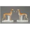 Image 1 : A pair of Staffordshire figures of standing greyhounds, with shaded tan coats and each holding a...