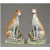 Image 1 : An unusual and well modelled pair of seated greyhounds, with shaded tan coats and well defined mu...