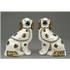 Image 1 : A pair of Staffordshire figures of seated spaniels, with copper lustre splashed coats, collars an...