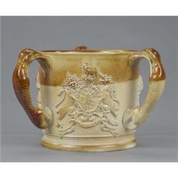 A large stoneware commemorative tyg, moulded with bust portraits of William IV and Adelaide, and...