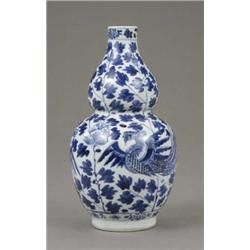 A Chinese double gourd shaped vase, painted in blue with phoenix and chrysanthemums, 7in high, Ka...
