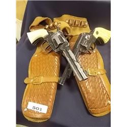 VINTAGE TOYS - 2 "DAISY" DIE CAST GUNS WITH LEATHER HOLSTER - 1950'S