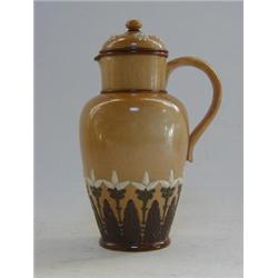 A DOULTON LAMBETH PITCHER, and cover, late 19th Century, salt glazed with sprigged stylized flowe...
