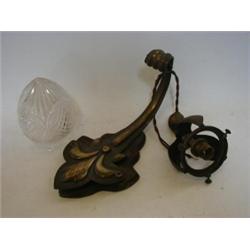 A SET OF EIGHT WALL LIGHTS, early 20th Century, brass finish inverted fleur de lys bracket, flex...