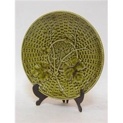 A SARREGUEMINES MAJOLICA TAZZA, moulded vine leaves on a basket weave ground, impressed 'Depose',...