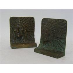 A PAIR OF BRONZE BOOKENDS, modelled as tribal Indian faces, height 14cm, (2)  20-30...
