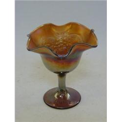A CARNIVAL GLASS FOOTED DISH, marigold Peacock and urn design, wavy rim, height 14cm, and an emer...