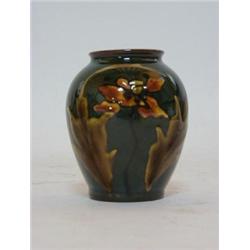 A SMALL ART POTTERY VASE, late 19th Century, glazed terracotta, foliage design, unmarked, height...