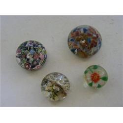 A MILLEFIORE GLASS PAPERWEIGHT, a lampwork example (pontil base), a flower and crystal inclusion...