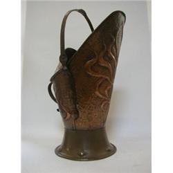 AN ARTS AND CRAFTS STYLE COPPER COAL BUCKET, stylized floral motifs on a hammered finish ground,...