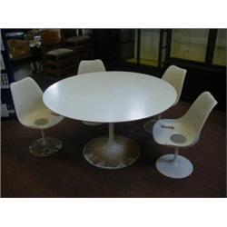 SAARINEN, EERO a 'tulip table and four matching swivel chairs, plastic and aluminium,cream finish...