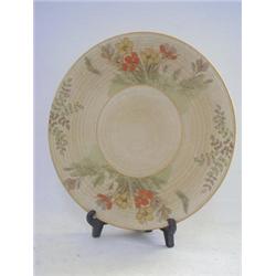 A CROWN DUCAL CIRCULAR WALL PLAQUE, crocus on a biscuit ground, diameter 31cm  100-150...