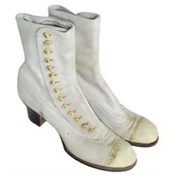 1 pair of ladies white leather high top button shoes, early 1900's.