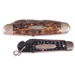 2 Buster Brown Shoes pocket knives, both w/brown staghorn sides, one has chain.