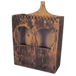 Hanging primitive wooden candle box w/2 holes & notched top, old brown paint, 14"H.