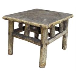 Small tree branch stool w/old leather top.