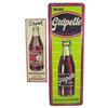 Image 1 : Lot of 2 tin signs: Embossed  Nichol Cola, 24"L & embossed Grapette, 39"L.