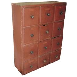 12 drawer apothecary cupboard, oxblood red over pine, original knobs & varmint hole in one drawer, 2